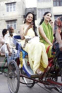 women riding a rickshaw