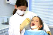girl getting dental check up
